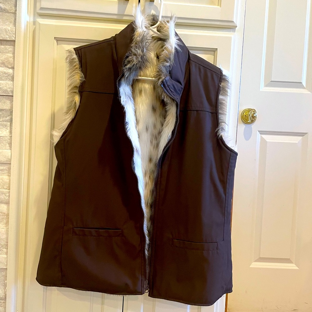 Size medium, excellent condition, reversible animal print vest.